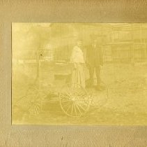 Unidentified Man and Woman on a Wagon